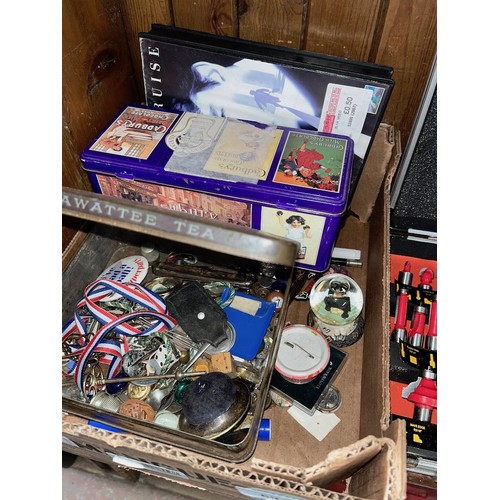 69 - A box and a tin of collectables to include various badges, a silver plated pin cushion, coins, etc.