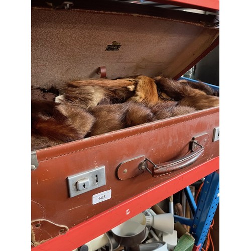 143 - A large vintage case and a bag of various furs.