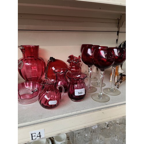 560 - 14 items of cranberry and ruby glass including 6 wine glasses