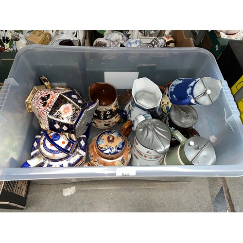 542 - A box of steins, jugs and tea pots to include German, Doulton Lambeth, etc.