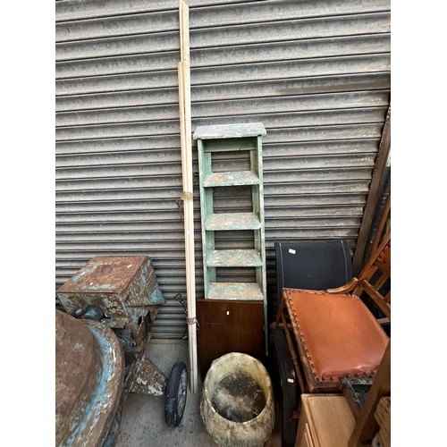 A set of wooden stepladders and a pulley maid clothes airer.