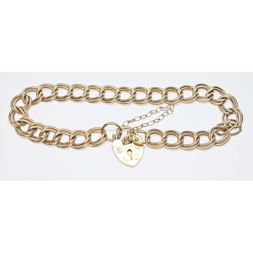 1 - A hallmarked 9ct gold bracelet with heart shaped padlock clasp, length 15.5cm, wt. 11.9g.