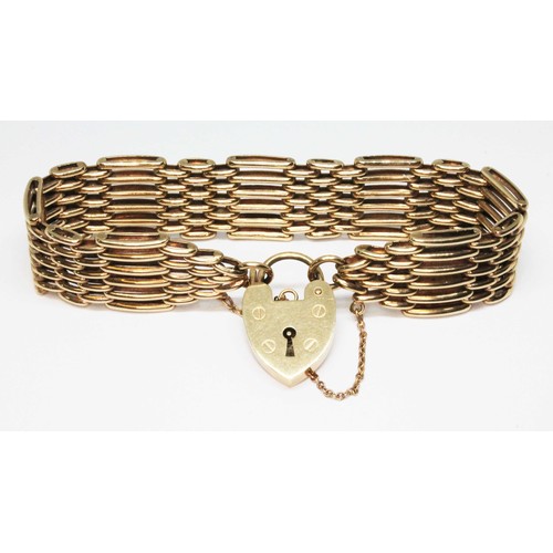 6 - A hallmarked 9ct gold bracelet with heart shaped padlock clasp, length 16cm, wt. 25.1g.