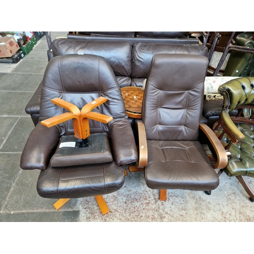 1049 - A brown leather effect recliner armchair and footstool together with another similar armchair.