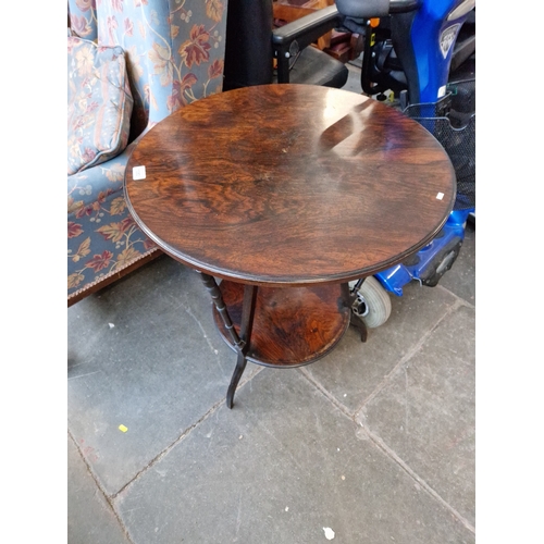 1050 - A late Victorian Aesthetic Movement rosewood occasional table with ebonised supports.