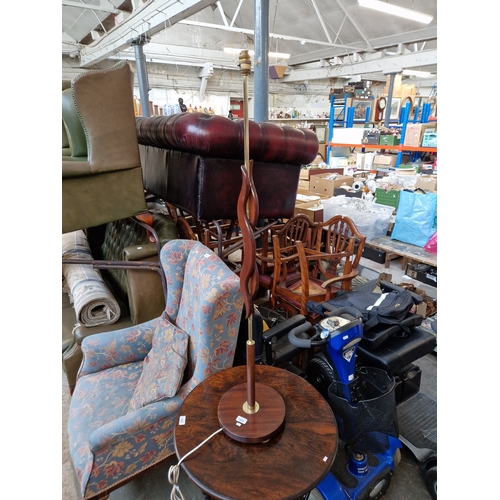 1051 - A retro mid 20th century mahogany and brass standard lamp.