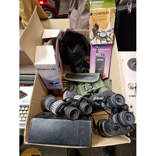 181 - A box of binoculars, compass, scanner mini tripod.