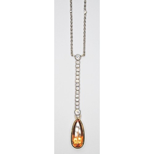 69 - A diamond and orange topaz negligee necklace, the bezel mounted pear cut topaz weighing approx. 5.77... 