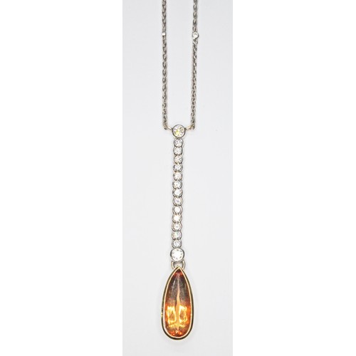 69 - A diamond and orange topaz negligee necklace, the bezel mounted pear cut topaz weighing approx. 5.77... 