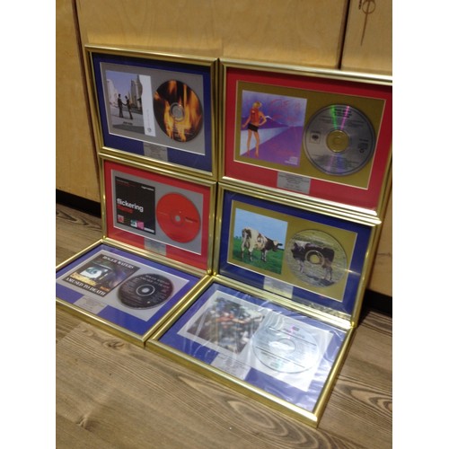 8 - A group of six Pink Floyd and associated framed CDs comprising Wish you were Here, Atom Heart Mother... 