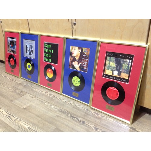 3 - Five Pink Floyd associated framed vinyl singles comprising Roger Waters Radio Waves, What God Wants ... 