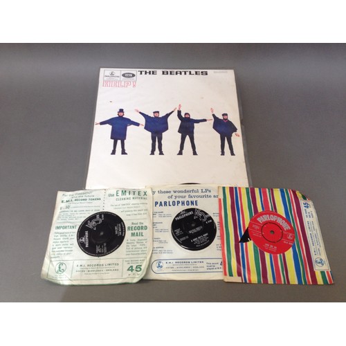 55 - The Beatles - Help! and three singles: Love Me Do, A Hard Day's Night and I Want To Hold Your Hand.