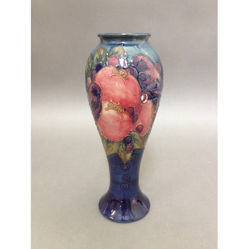 70 - A Moorcroft pottery vase of inverted baluster form, tube line decoration depicting pomegranates, bir... 