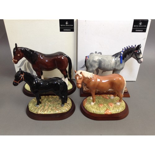 95 - A group of four Beswick horses comprising Shetland Pony, My First Pony, Shire & Clydesdale, two with... 