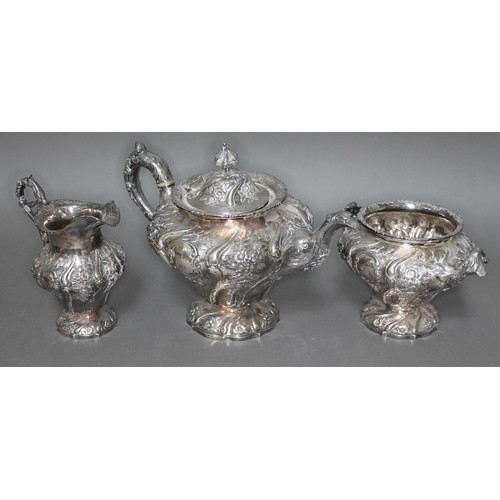 118 - A William IV Scottish silver tea set, repousse decoration depicting floral bouquets and scrolls, Eld... 