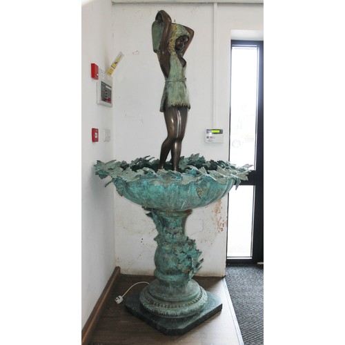 138 - A bronze garden fountain, modelled as a woman with water jug, bowl decorated with vine leaves and gr... 