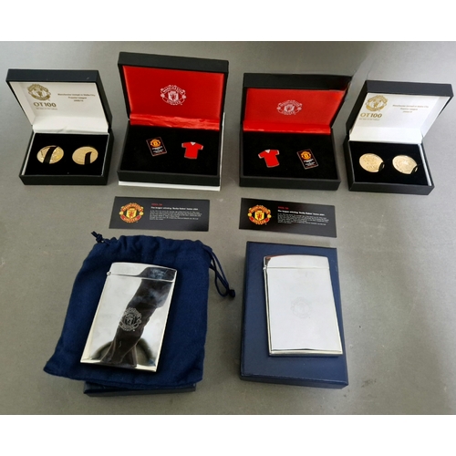 67 - Manchester United memorabilia to include coins, badges and 2 Aquascutum Man United chromed card hold... 