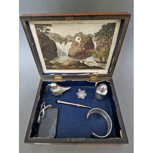 70 - A lidded wooden box containing vintage collectables to include a bracelet marked 925, snuff box mode... 