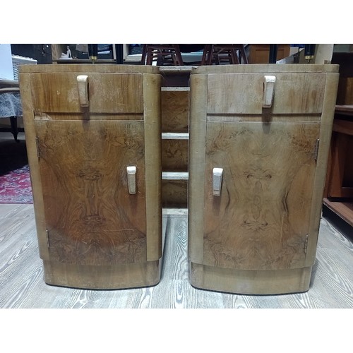 142 - A pair of Art Deco figured walnut bedside cabinets, height 67cm.