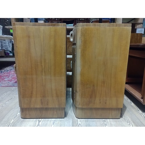 142 - A pair of Art Deco figured walnut bedside cabinets, height 67cm.