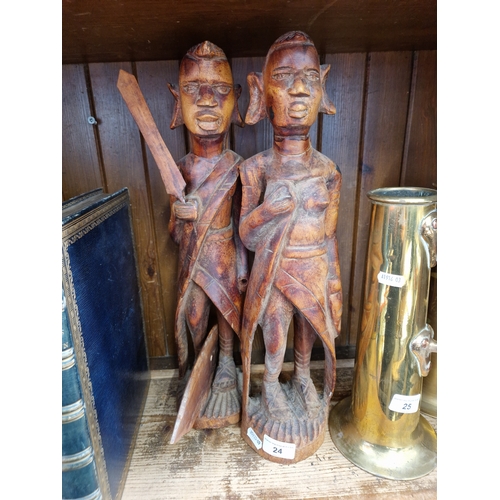 24 - A pair of African carved wood figures, height 45cm.