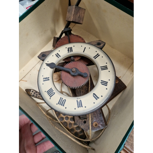 38 - A wooden wall clock with copper weights