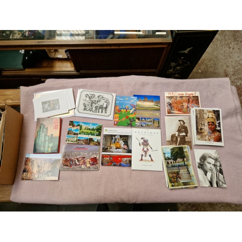 41 - A box containing unused post cards and video photo discs