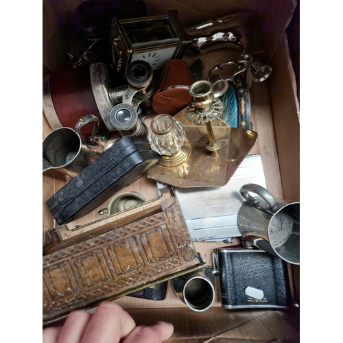 57 - A box of metalware including brass, plated ware, a carriage clock and 2 sets of binpculars etc