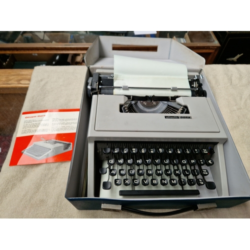 92 - An Olivetti Dora portable typewriter