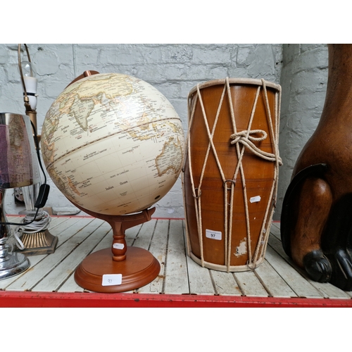 97 - A tom tom drum and a globe on a wooden base