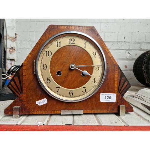 126 - A 1930s Art Deco walnut cased mantle clock, complete with pendulum and key.