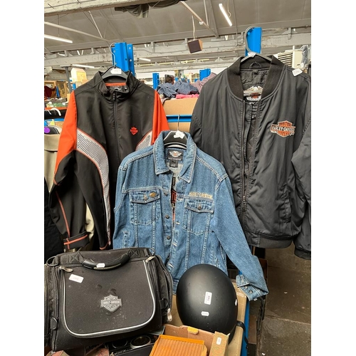 144 - A collection of Harley Davidson motor cycle items to include 2 nylon jackets (both Large size), a de... 