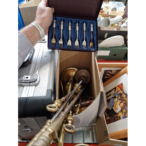 454 - A box of brassware including fireside irons and some forks