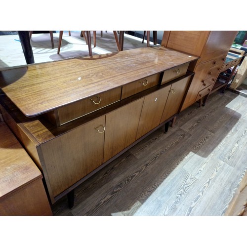 1069 - A vintage G Plan 'Librenza' tola teak and ebonised sideboard, length 149cm.