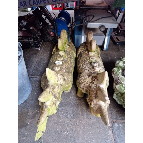 783 - A pair of dinosaur garden statues, 35cm height.