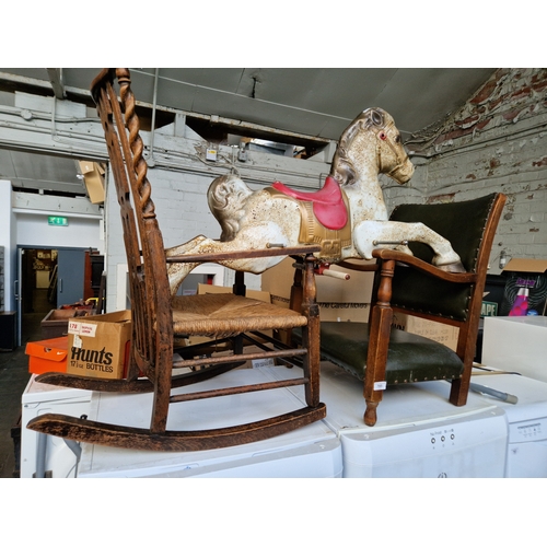 785 - A rush seat rocking chair, a nursing chair and a tin horse.