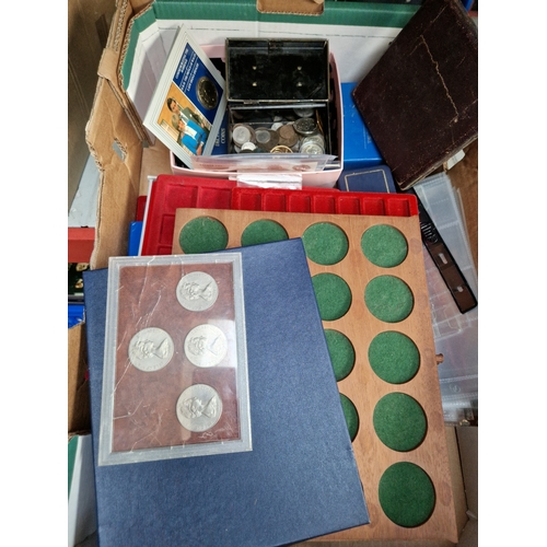 131 - A box of coin collector's items -empty cases and a few coins/tokens