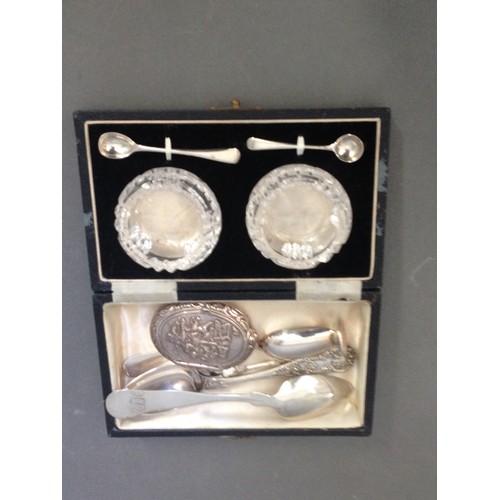 220 - A pair of boxed glass salts with hallmarked silver spoons together with various silver plated items.