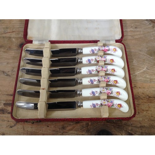 222 - A cased set of six Royal Crown Derby butter knives.