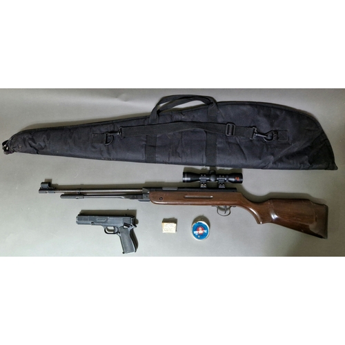 4 - A .177 calibre air rifle with a SMK 4 x 32 telescopic sight, 140cm long, with soft bag & tin of pell... 