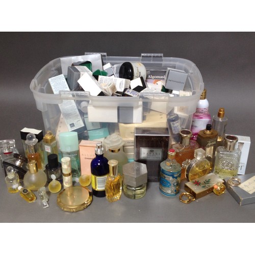 106 - A box of assorted perfumes and lotions.