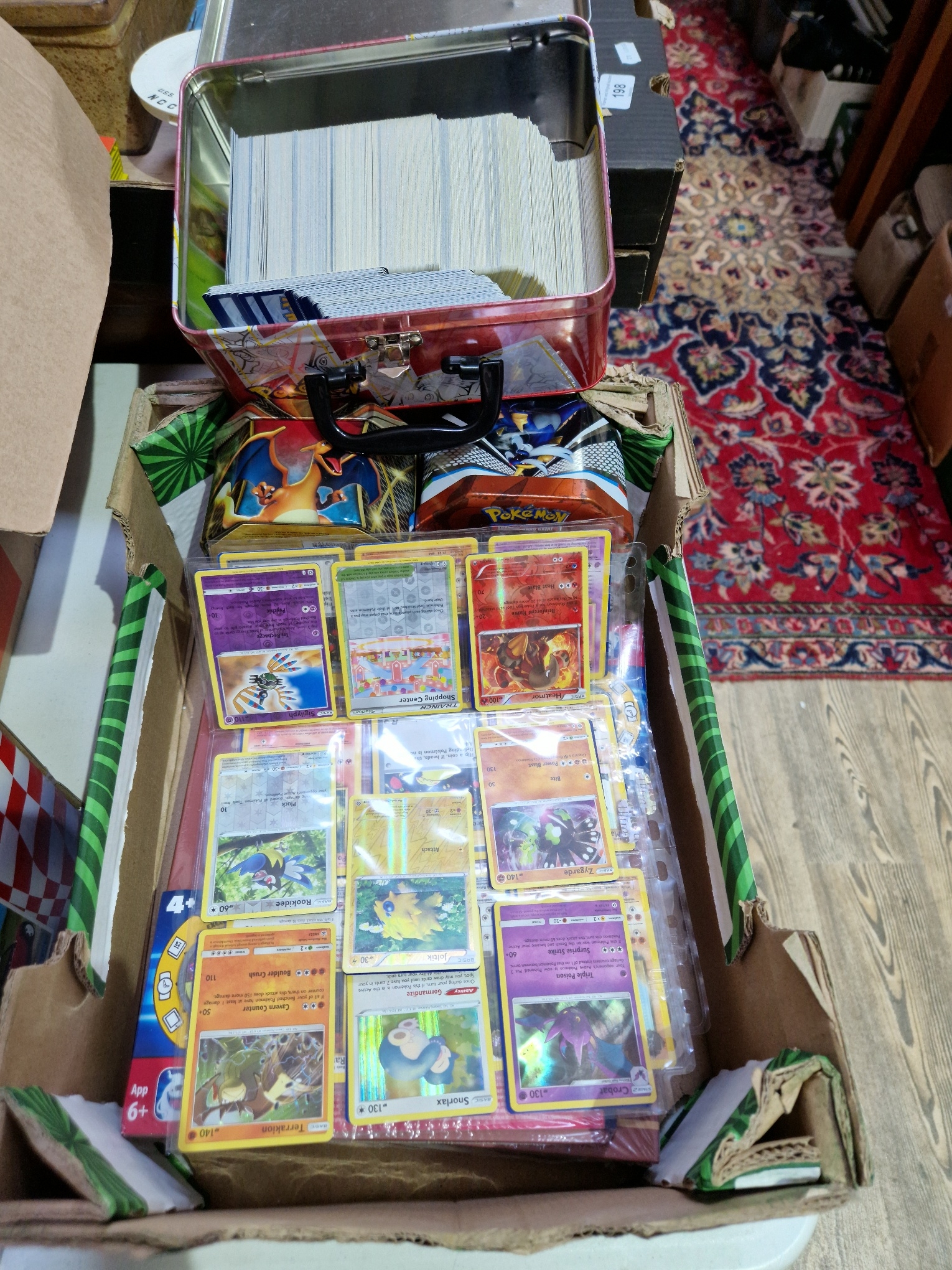 A box of Pokemon cards, approx. 1000 including holos and base set cards.