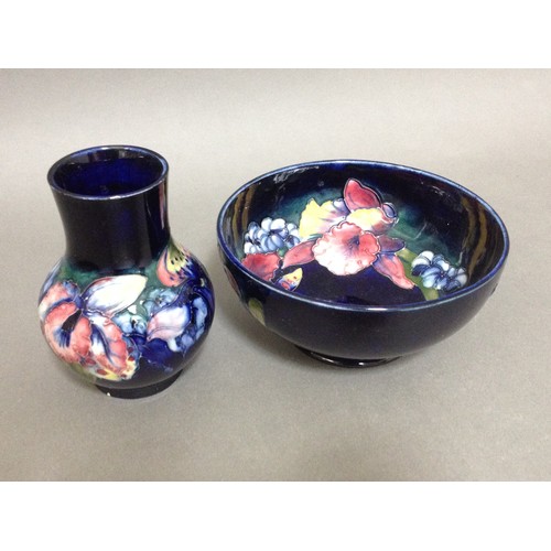 112 - Two pieces of Moorcroft pottery, bowl diam. 15.5cm, vase height 12.5cm.