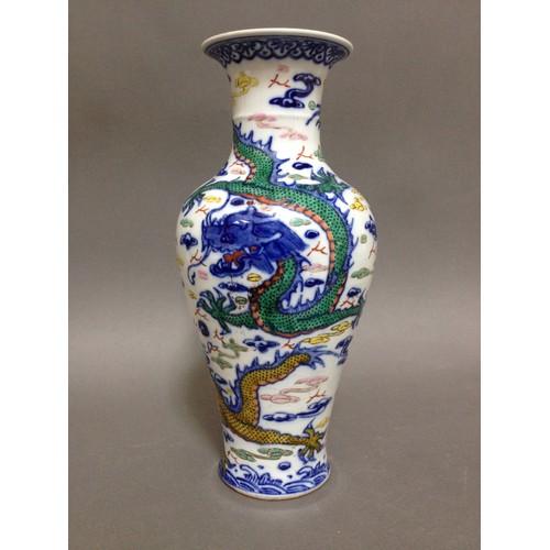 107 - A Chinese porcelain vase, decorated in over enamels dragons and clouds, bearing six character Qianlo... 