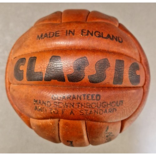 98 - An autographed brown leather football, circa 1960s, ten Liverpool FC signatures comprising Ian Calla... 