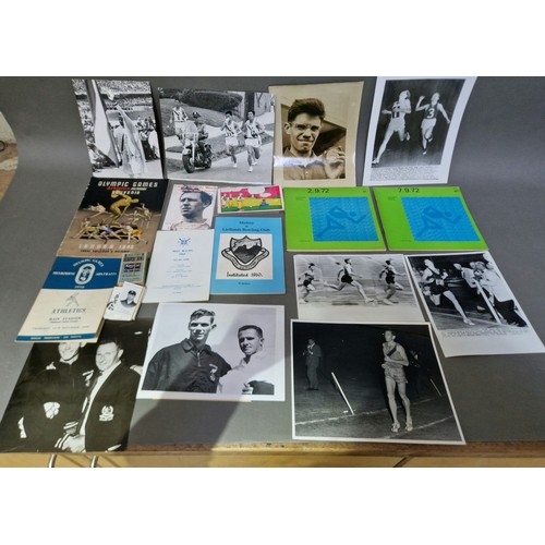 102 - A box of sporting ephemera to include Olympics, various years, programmes, press photographs, cigare... 