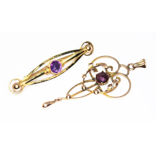 62 - An amethyst set bar brooch marked '15c' length 43mm wt. 2.8g, together with an Edwardian Art Nouveau... 