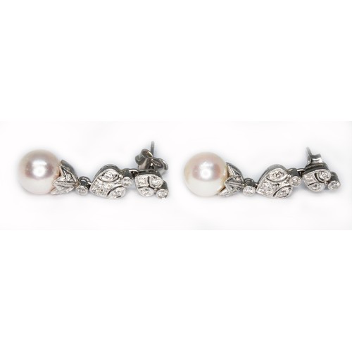 82 - A pair of South Sea cultured pearl and diamond drop earrings, the pearls approx. 8mm in diameter, le... 