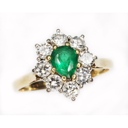 72 - An emerald and diamond cluster ring, the central pear cut stone weighing approx. 0.50cts, surround b... 