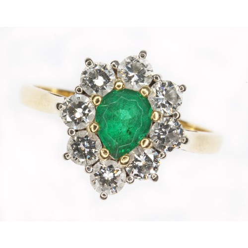 72 - An emerald and diamond cluster ring, the central pear cut stone weighing approx. 0.50cts, surround b... 